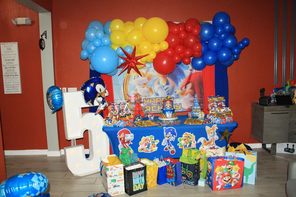 5th birthday table and backdrop setup