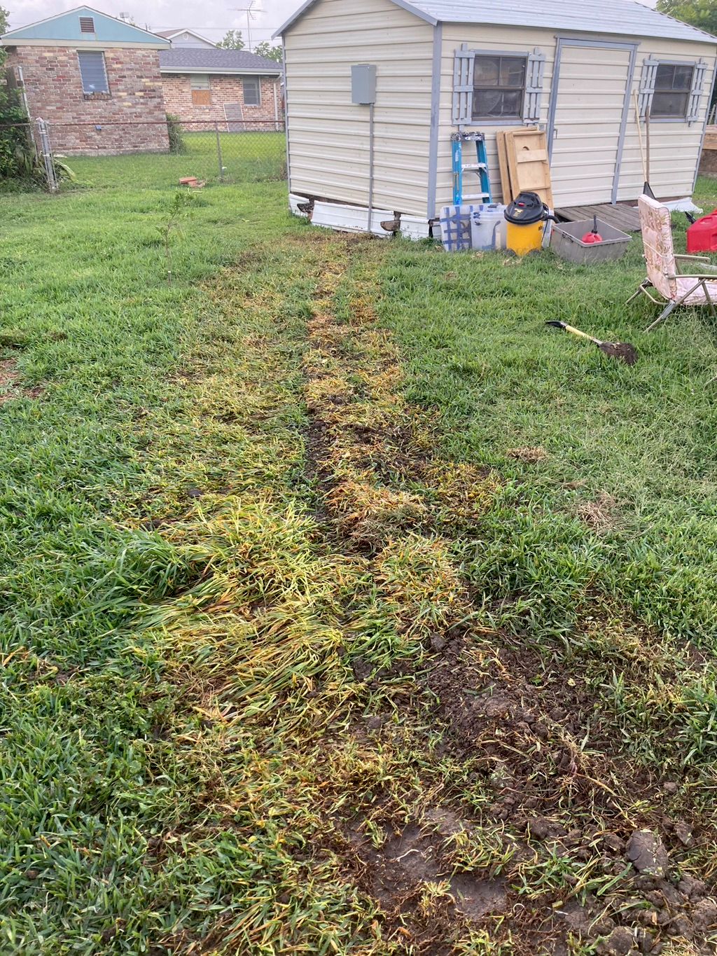 Dug trench, laid pipe down, and backfilled trench,