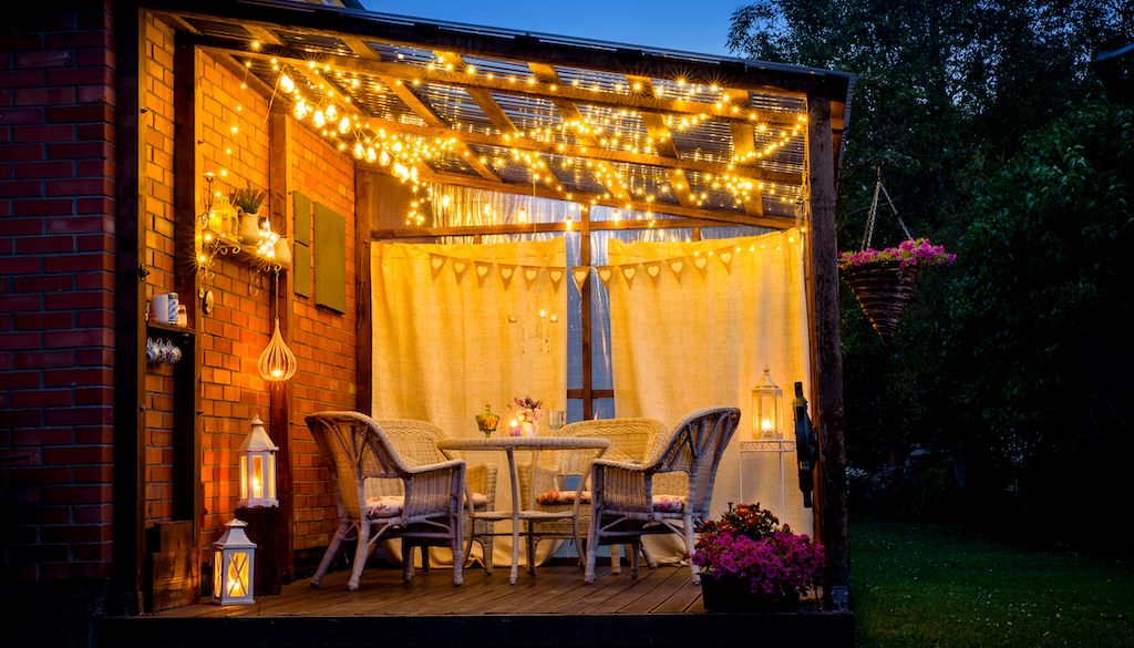 string lights in backyard sitting area