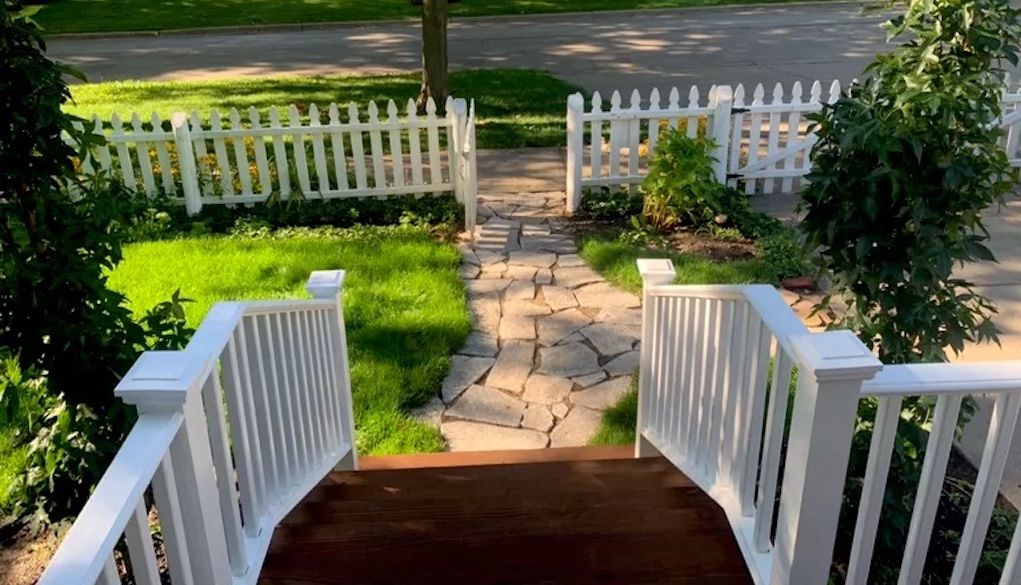 short pathway in small front yard leading to doore