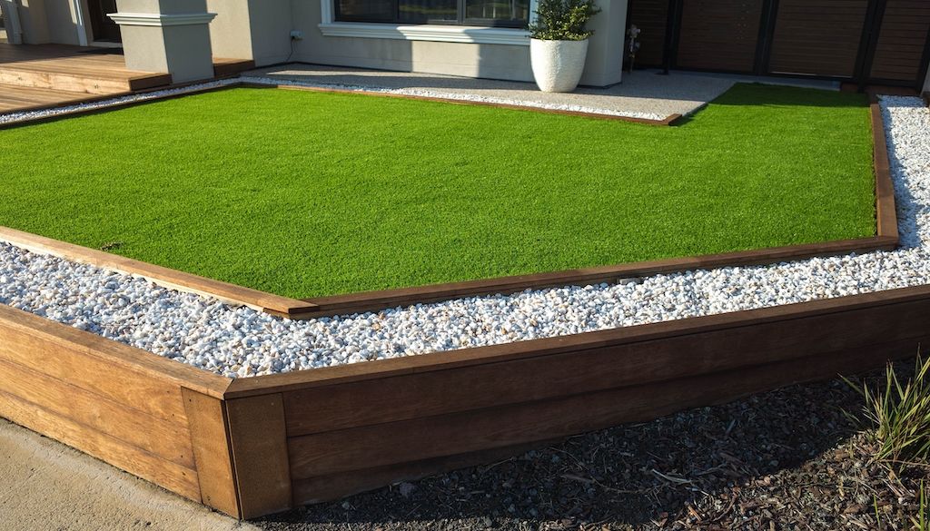 wood and rock lawn edging in small front yard