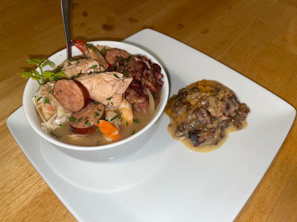 Seafood gumbo with a side of sweet potato caserole