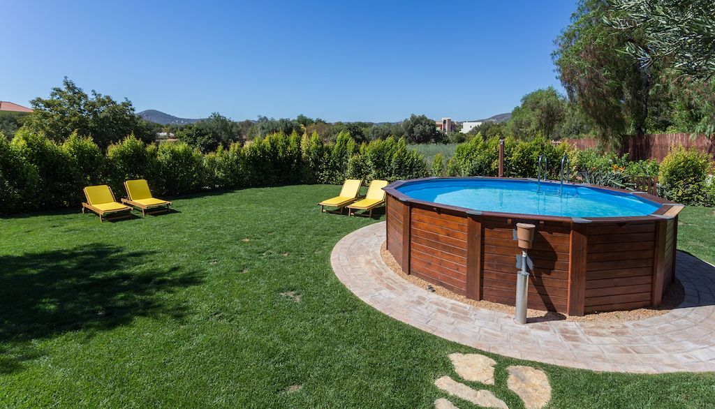 above ground pool sitting on concrete pad