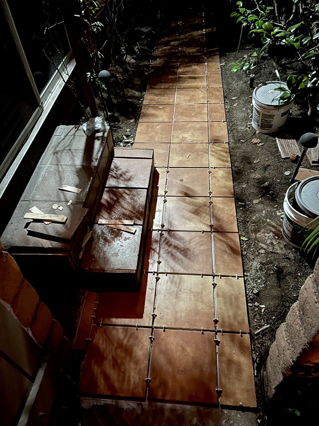 Made a concrete walkway and laid new tiles in the 