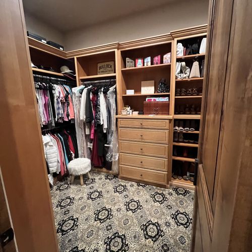 Organized women's walk-in closet.