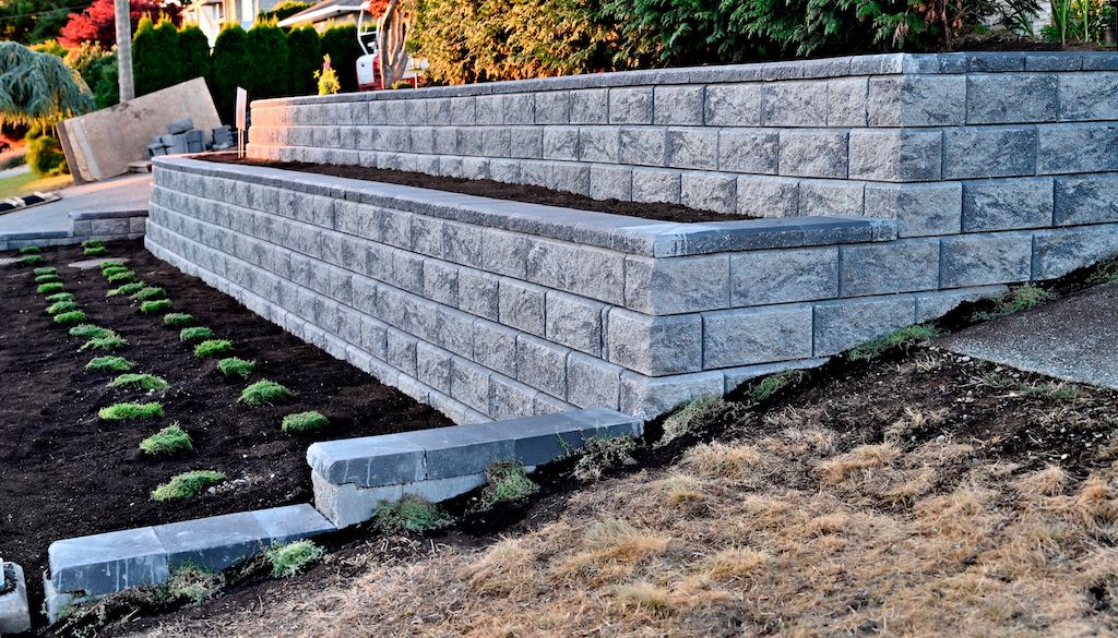 concrete retaining wall in front yard of house