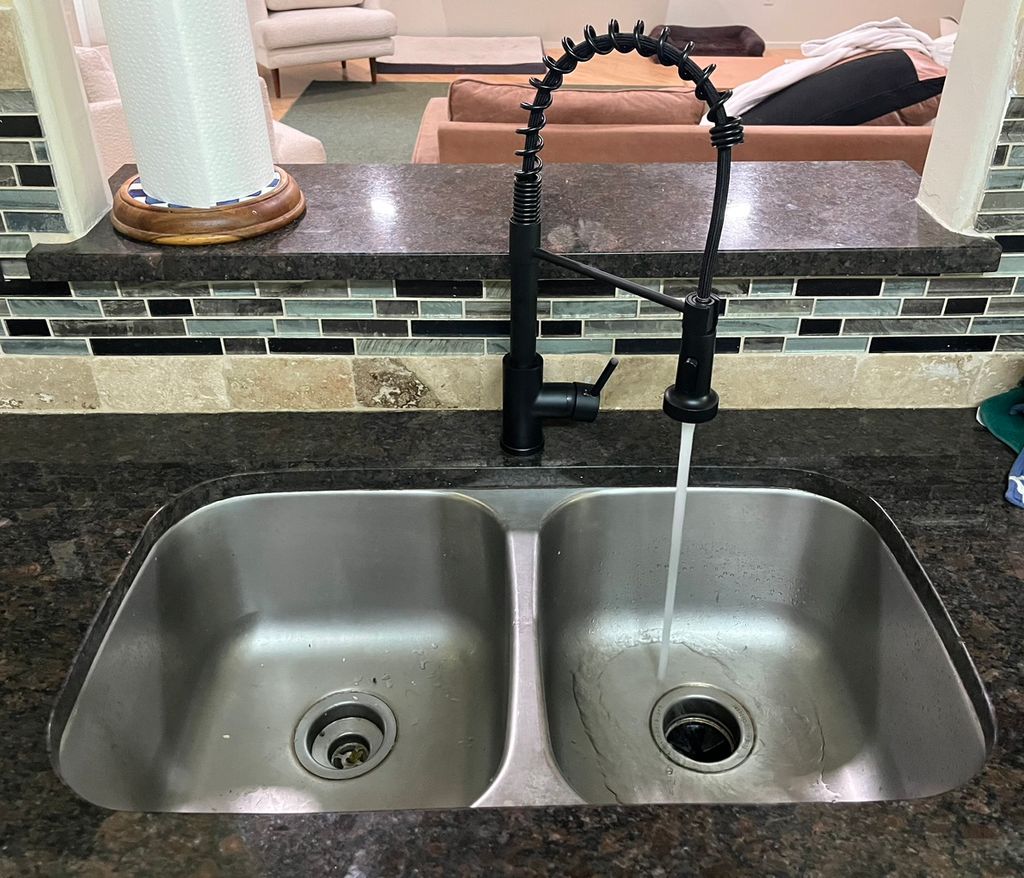 After. Photo of faucet running.