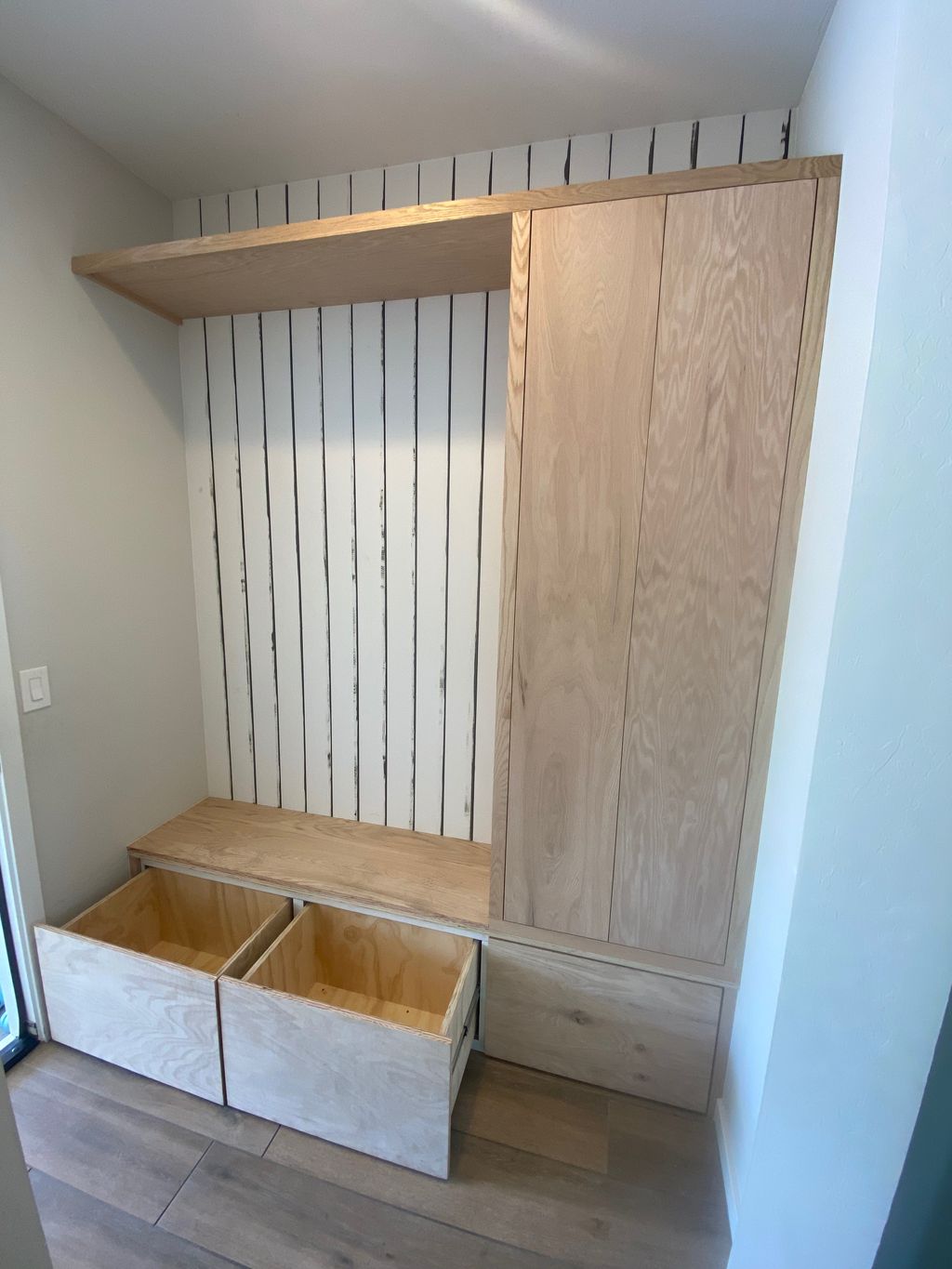 full custom red oak mud room cabinets and shiplap,