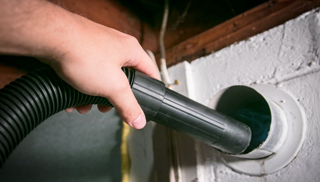 vacuuming out lint in dryer vent