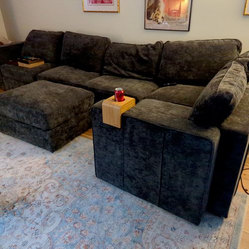 He put together a large Lovesac sectional. The dir