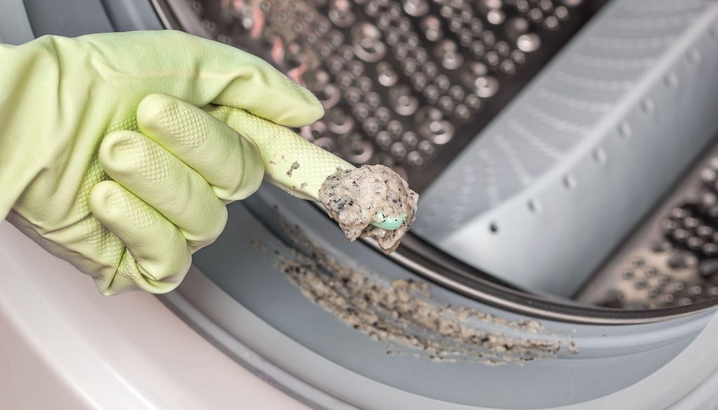 soap scum and dirt buildup in washing machine