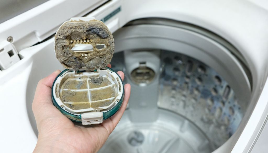 dirty washing machine filter causing bad smells