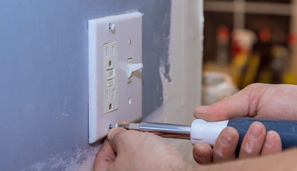 Removing wall light switch cover in order to mask the outlet in preparation for painting
