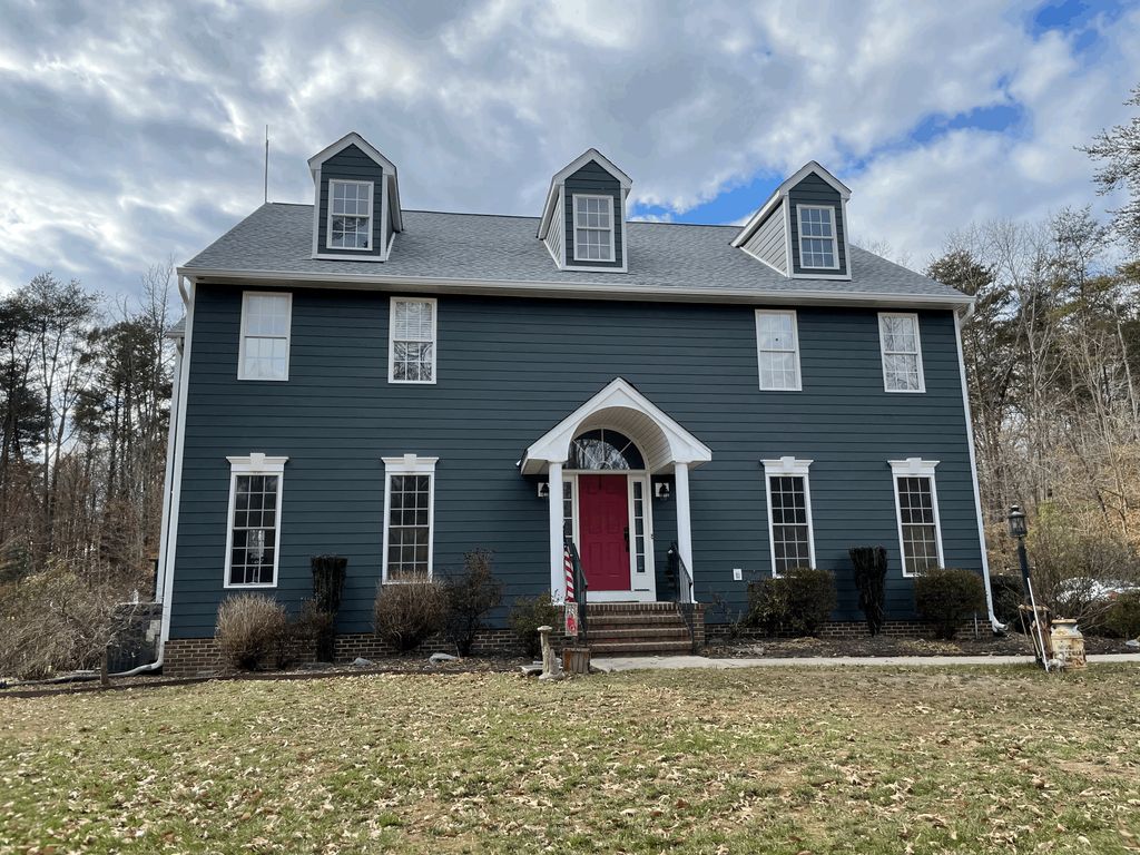 After. Roof and James Hardie Siding Replacement