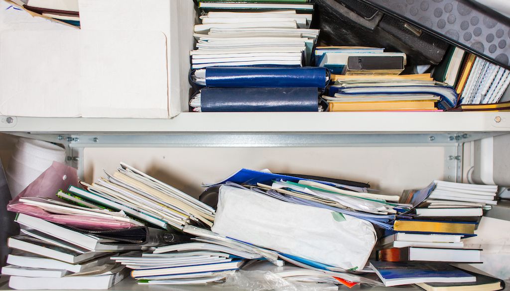 paper and supplies in mess filing cabinet