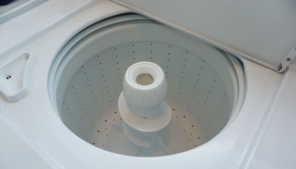 sparkly clean top loading washing machine with door open