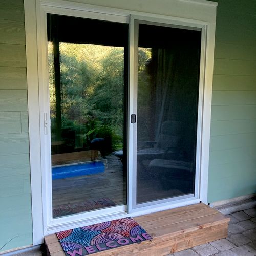 Nick replaced a window with a sliding glass door a