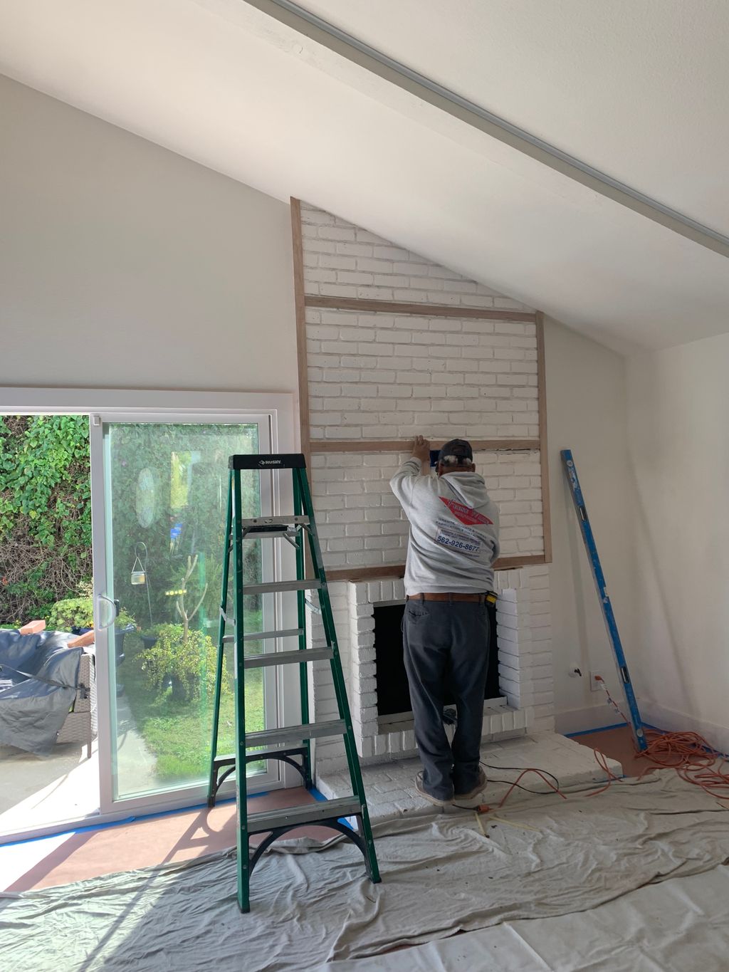 Quartz material installation above fireplace 2