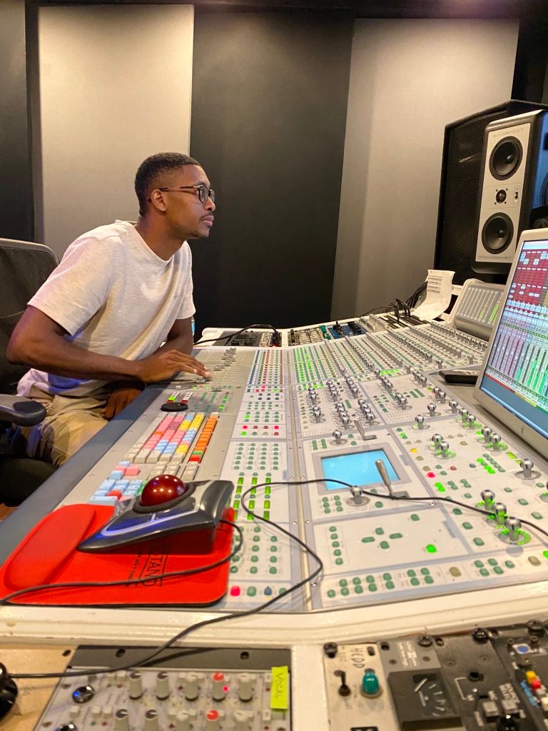 Student artist mixing his record