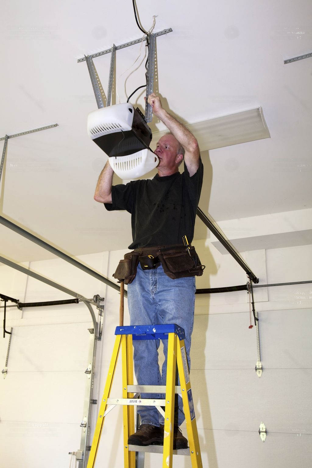 Tim performing a garage door repair