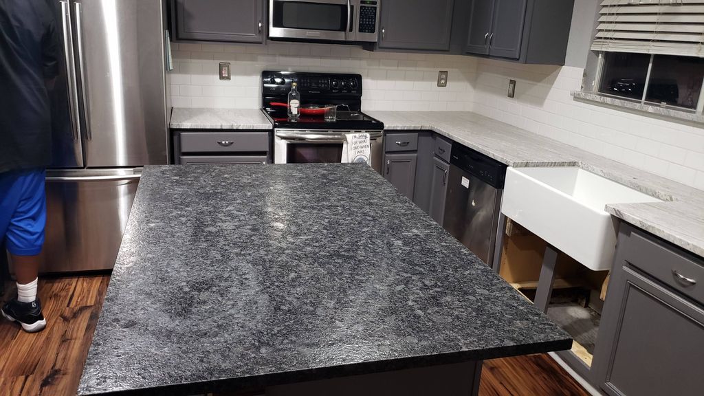 Dakota Mahogany granite Island in quartz kitchen w