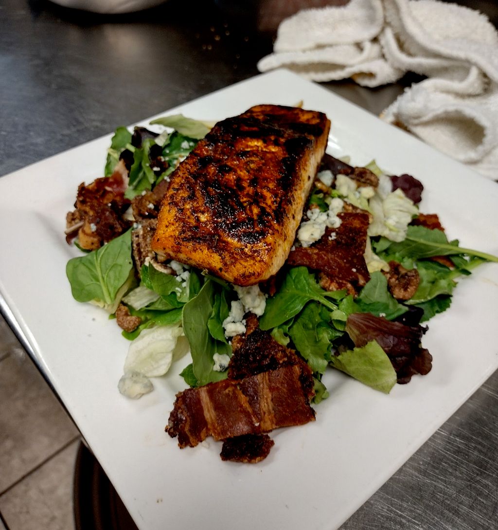 Seared salmon on a bed of spinach and watercress s