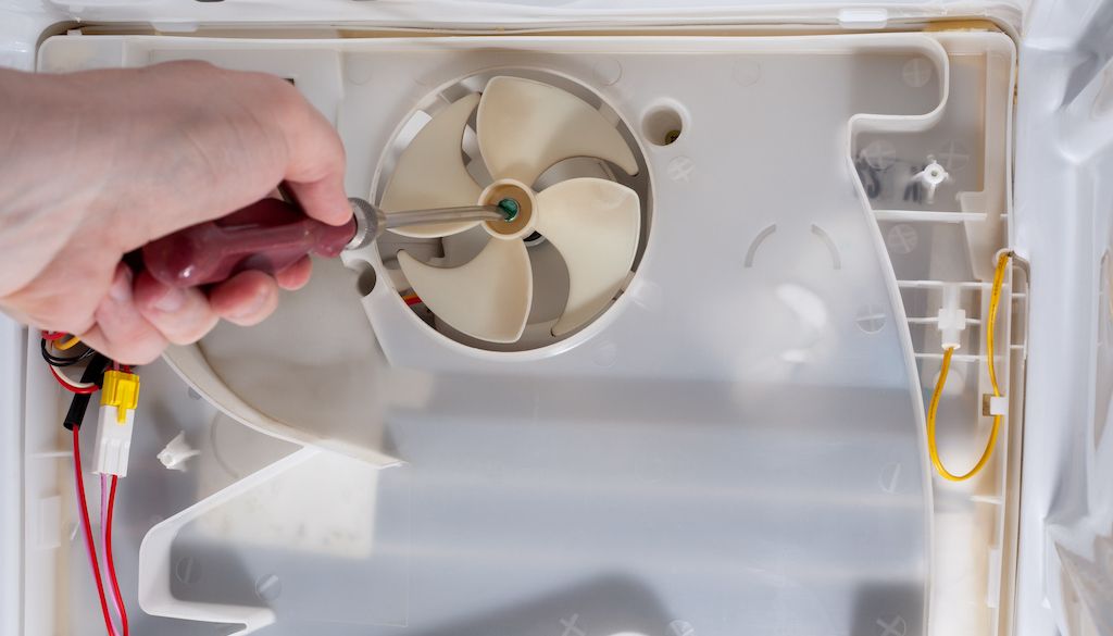 fan in refrigerator being repaired