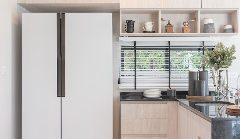 white side by side refrigerator in kitchen