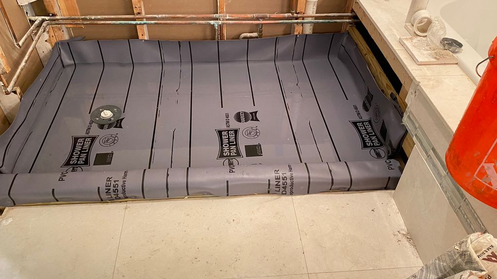 New shower pan with proper slope
 (water test)
