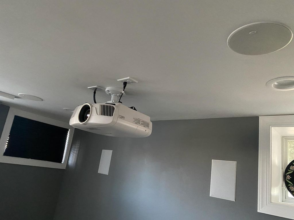 Projector installed with in-wall and in-ceiling sp