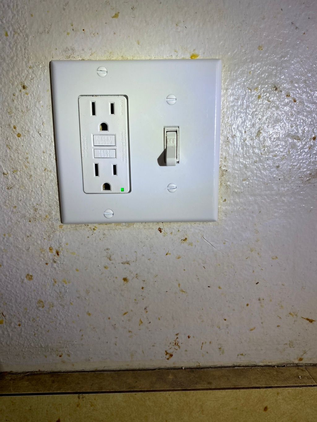 Gfci plug and switch installed in kitchen