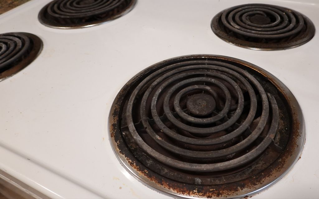 How to clean an electric stove top with metal coils.