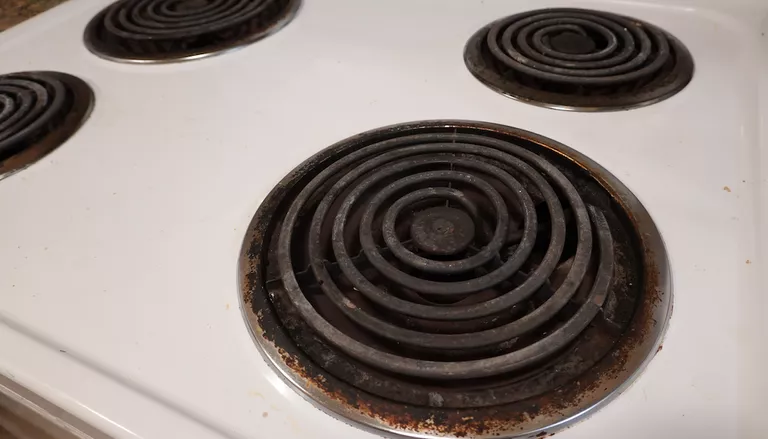 dirty electric stove top metal coils