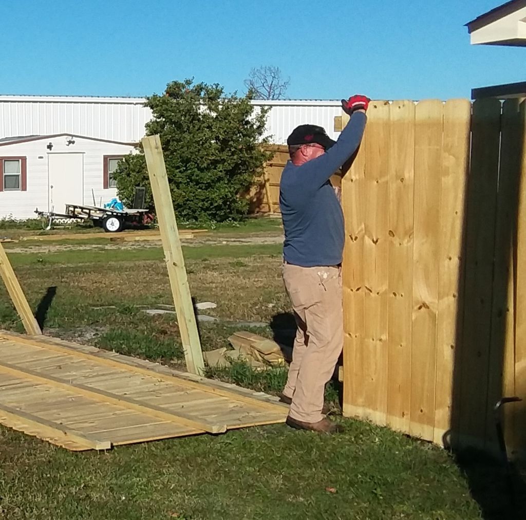 Repairing a fence installed by another company.