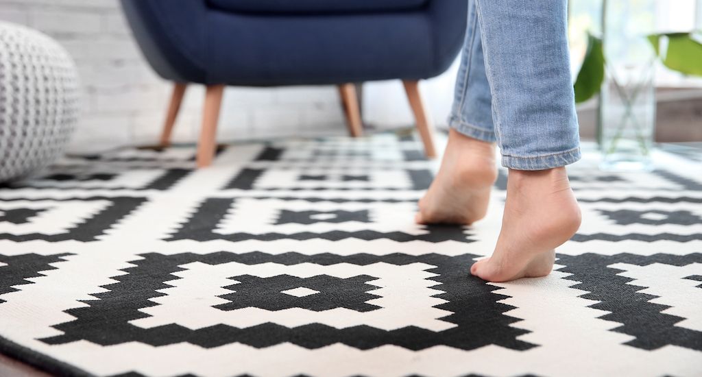 bare feet walking on carpeted flooring