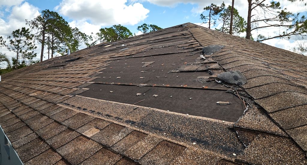 roof with missing asphalt shingles