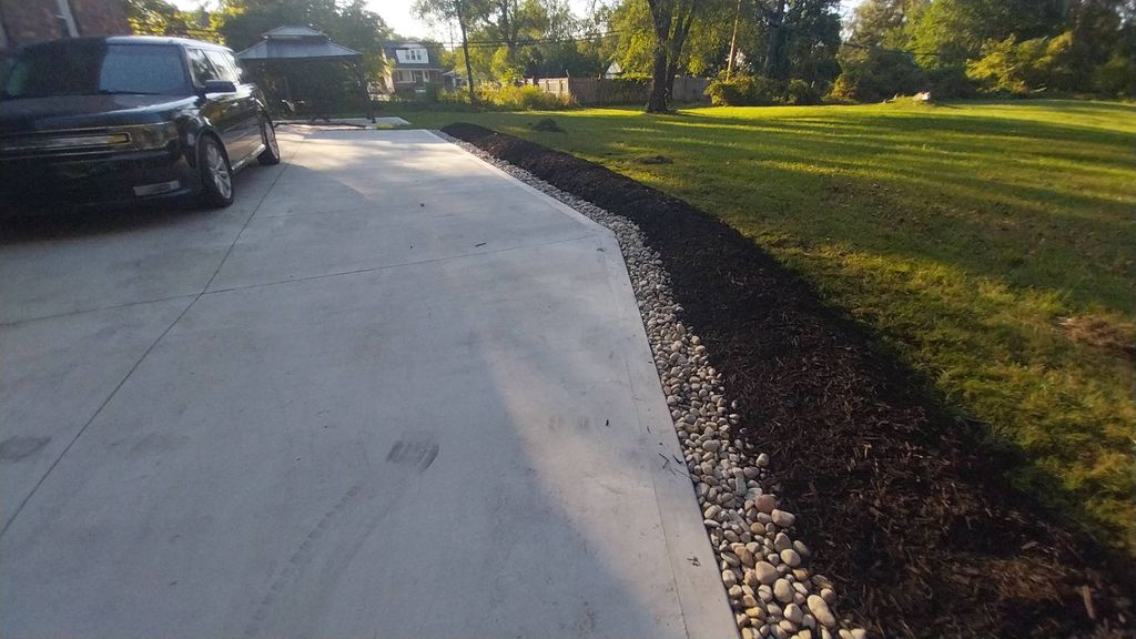Rock pathway and mulch bed installation