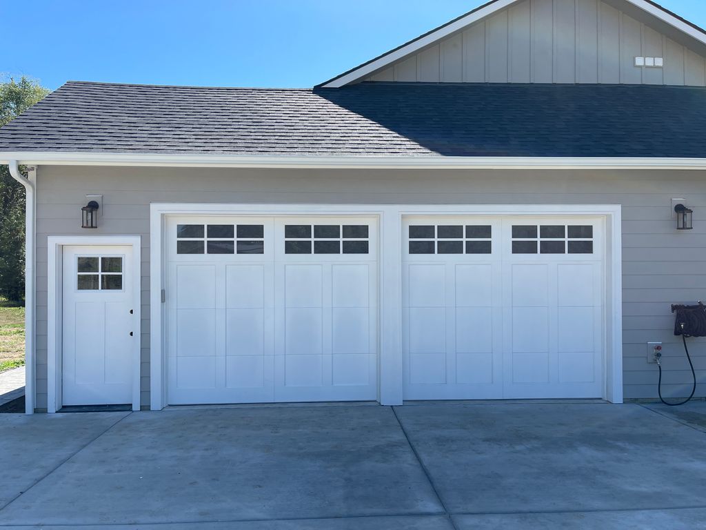 These 2 new carriage house garage doors matched pe