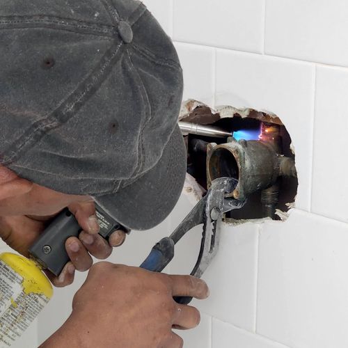 Ernesto replaced the shower valve in our bathroom.