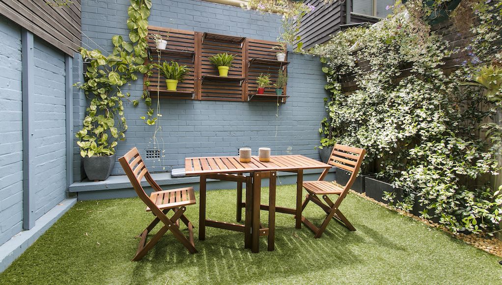 small cozy backyard garden with furniture