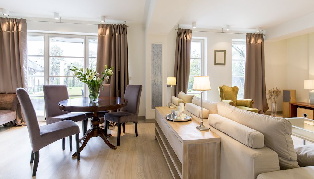 light colored living room with grey curtains