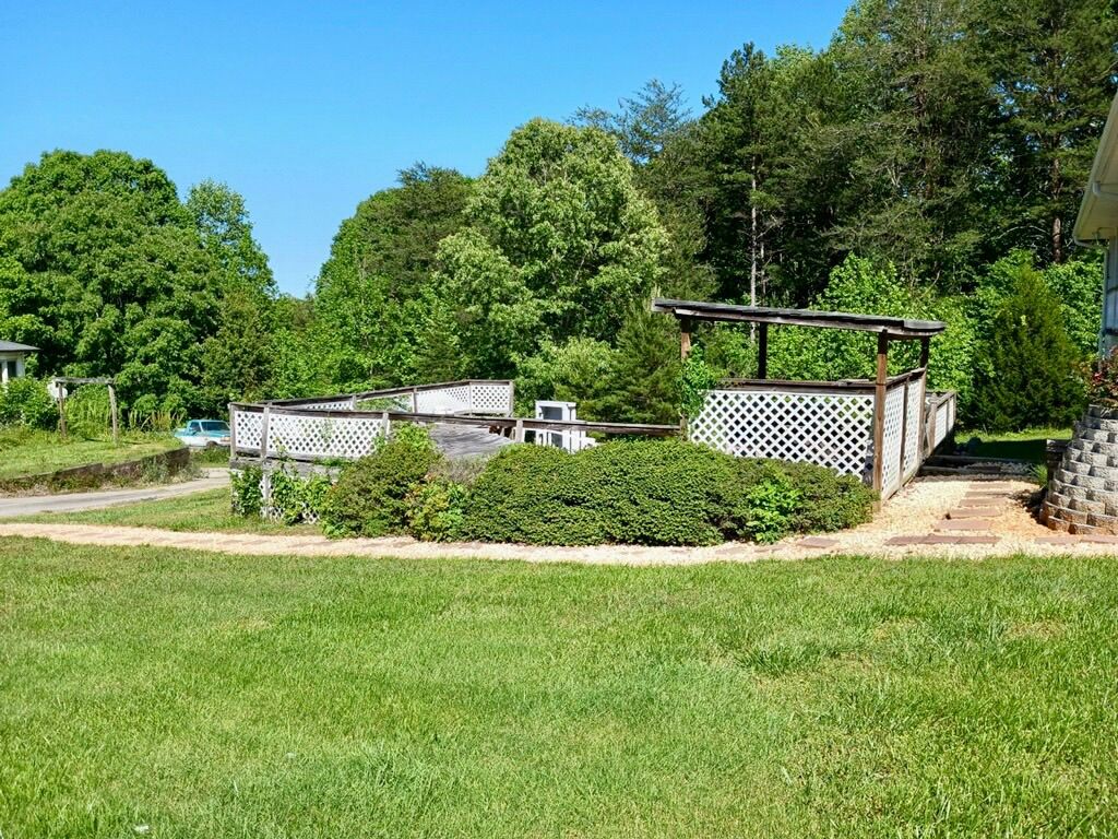 Before pool area demo, shrub removal, and grading 