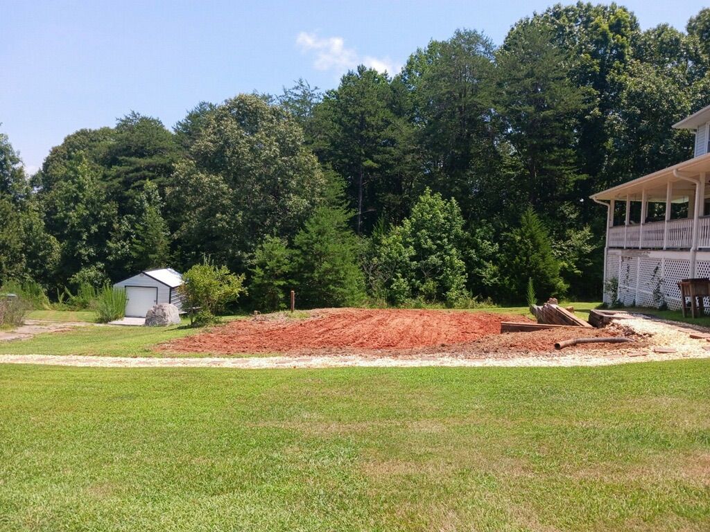 After: pool, deck, and shrubs removed and area gra