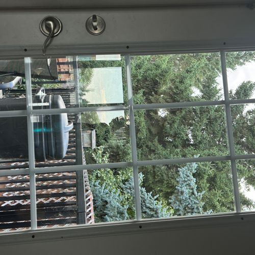 Exterior window cleaning for a two-story home. The