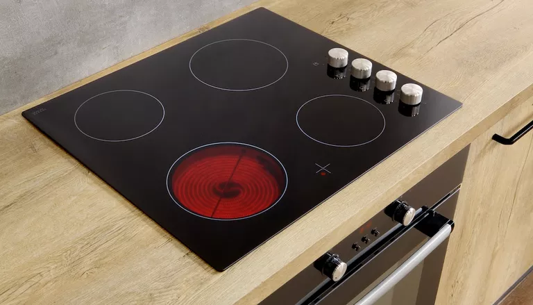 induction stove or cooktop on top of wooden kitchen counter