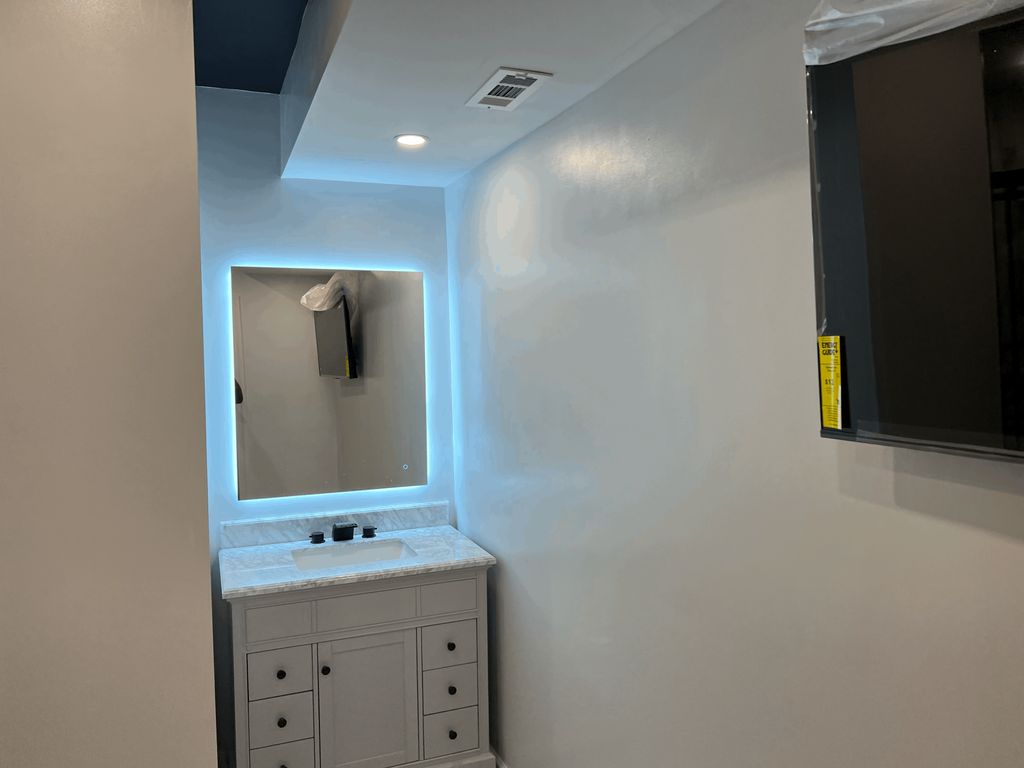 Bathroom with shampoo sink in a basement renovatio