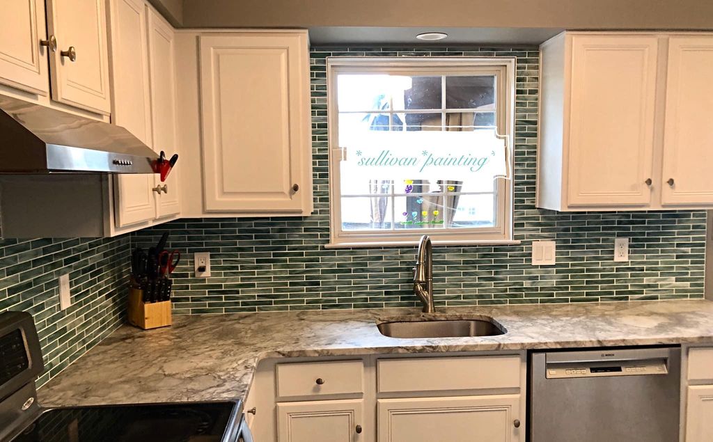 Installed backsplash, painted kitchen cabinets,  p