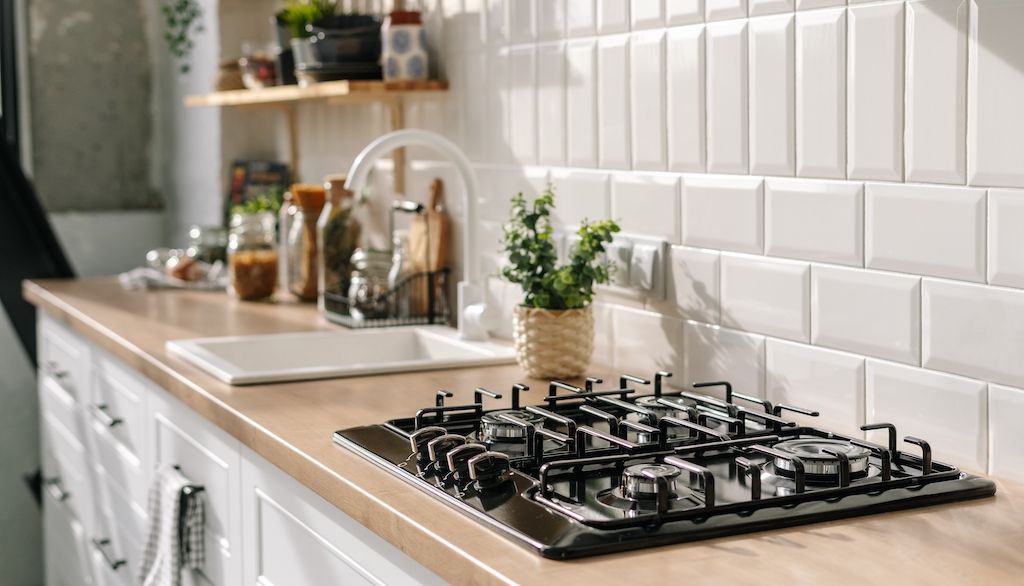 gas cooktop in open airy kitchen