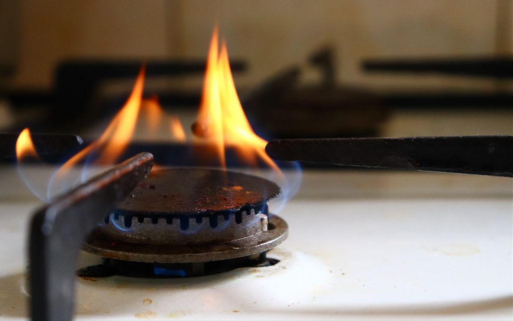 Why is there an orange flame on my gas stove?