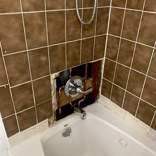 Opened wall and installed new shower body,new trim